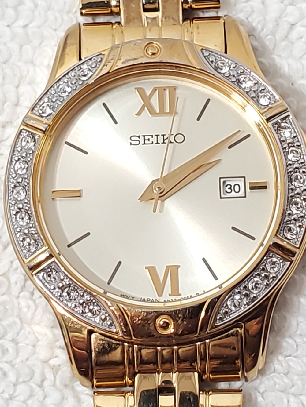 Seiko Women’s Date Quartz Watch Swarovski Crystal Gold Tone Roman Numerals